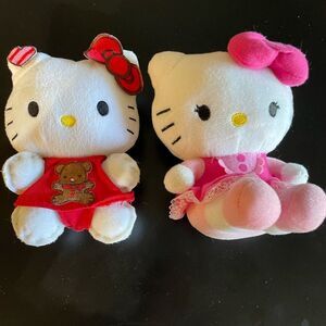 Two sanrio hello kitty plush animals one handmade red and pink outfit plushies